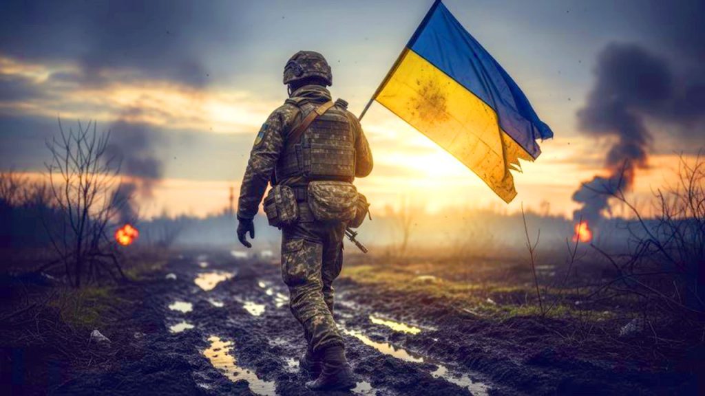 soldat sur le front portant le drapeau ukrainien. stocklib 248350960_m